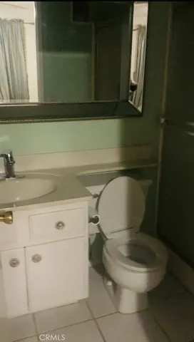 a bathroom with a toilet and a sink