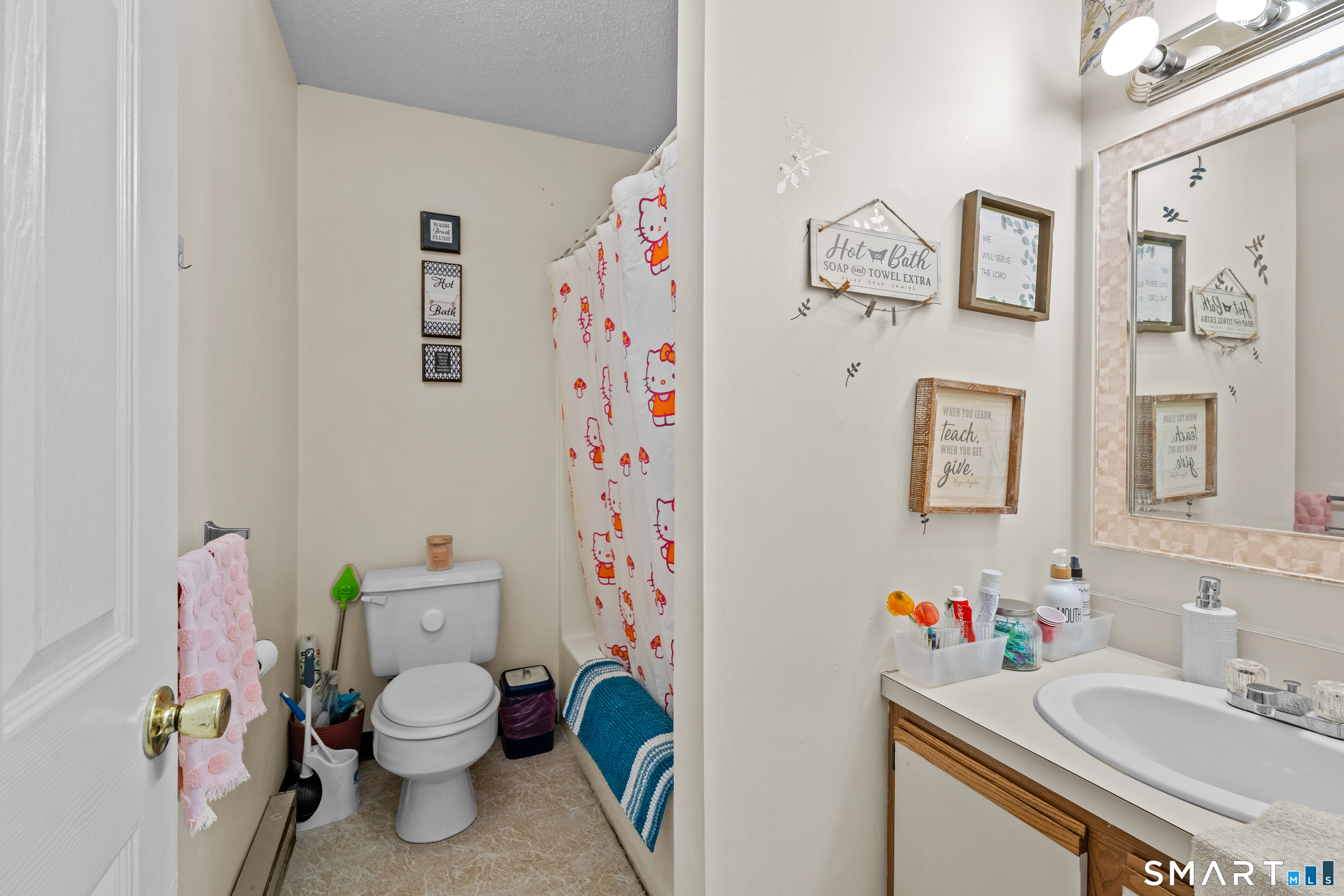 23 Pearl Lake Road, Unit B Waterbury, CT 06706 - Photo 13 of 14 a bathroom with a sink toilet and vanity
