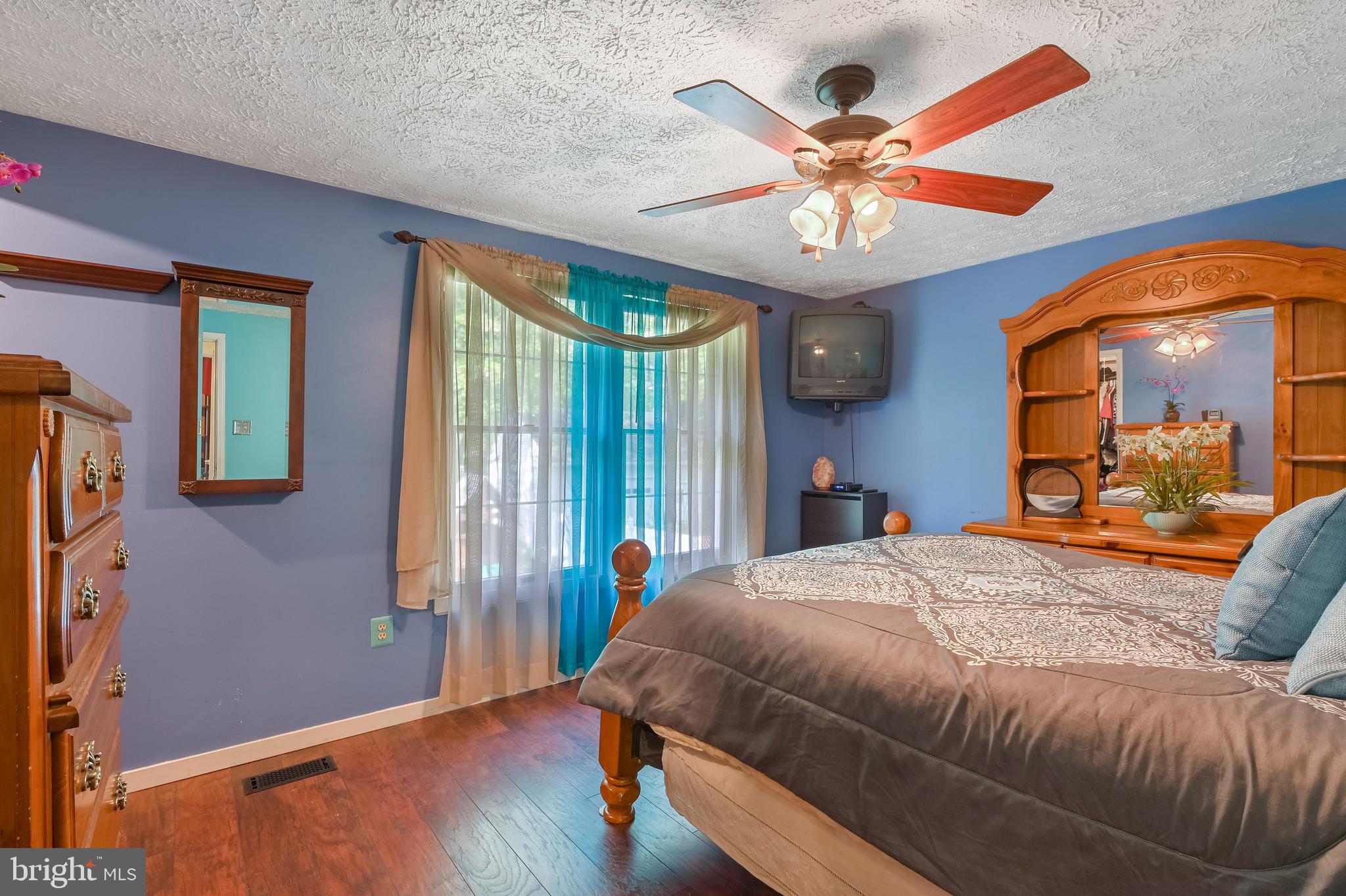 317 McKay Road Stevensville, MD 21666 - Photo 17 of 58 Bedroom #1 with ceiling fan & laminate