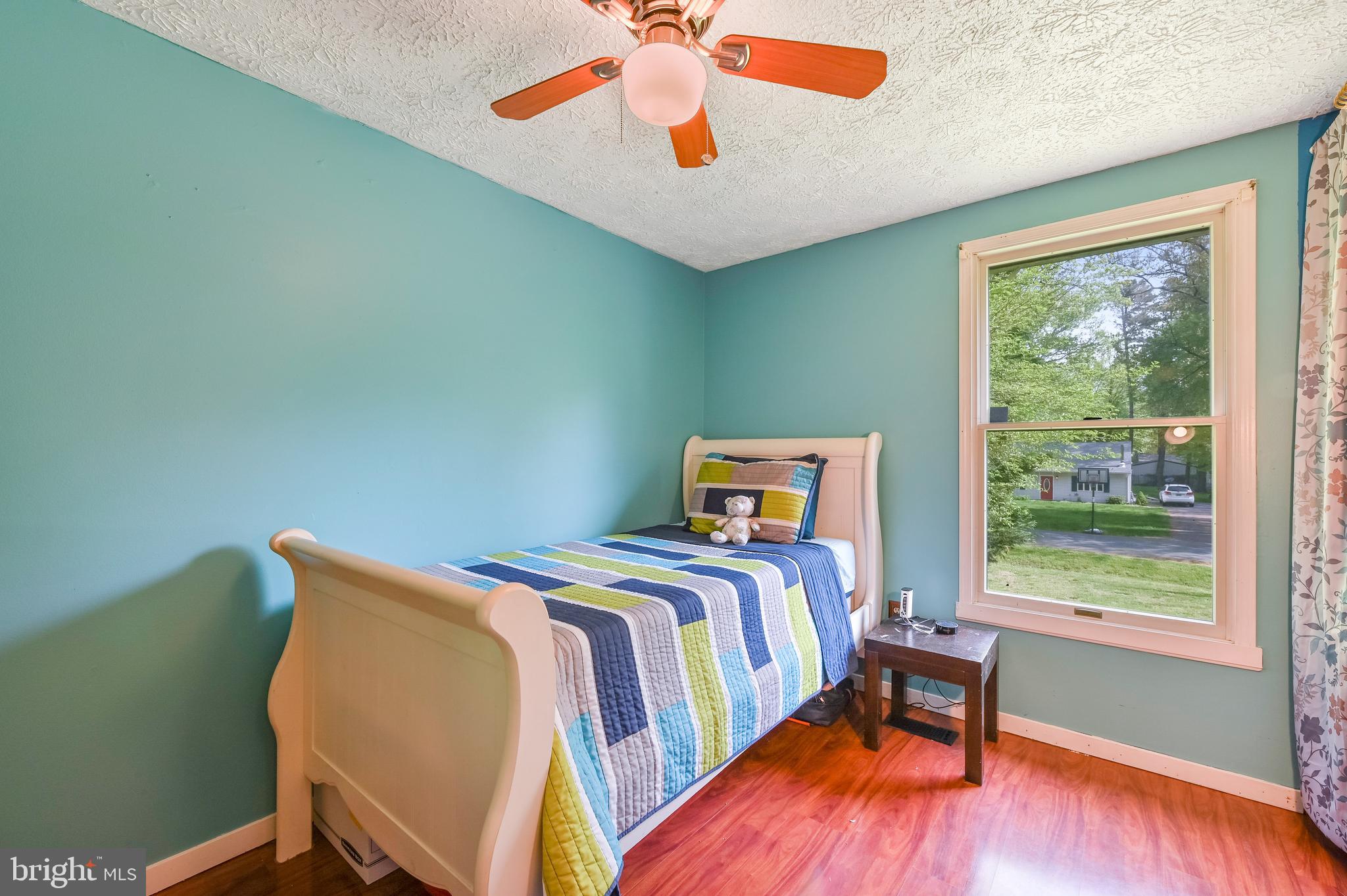 317 McKay Road Stevensville, MD 21666 - Photo 20 of 58 Bedroom #2 with ceiling fan & laminate