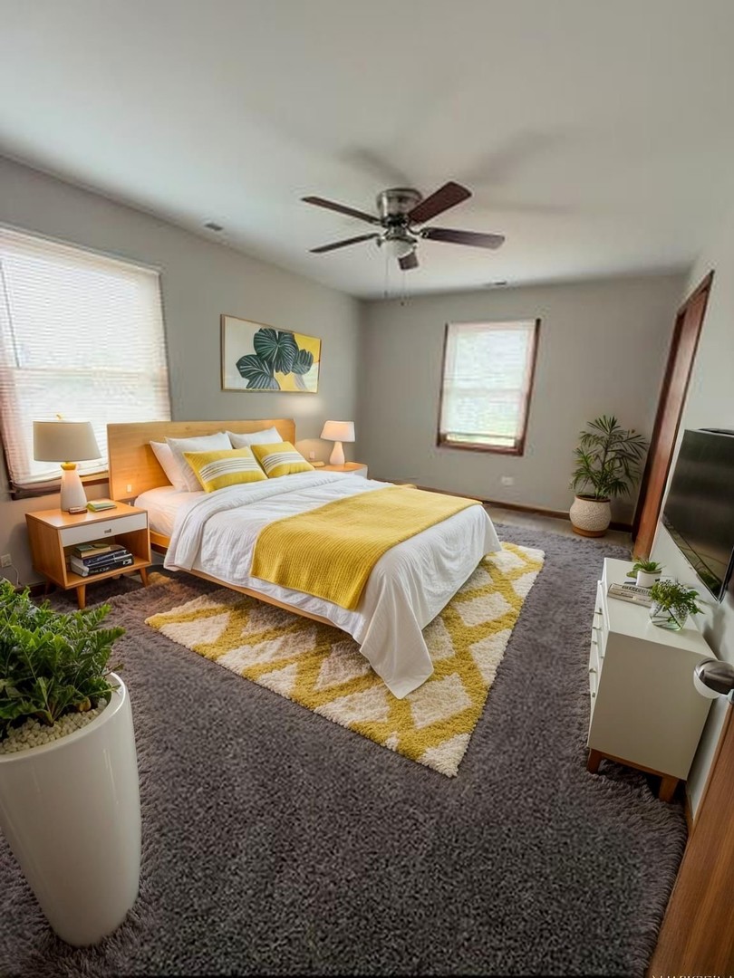 674 East Algonquin Road Des Plaines, IL 60016 - Photo 12 of 19 a bedroom with a bed a couch and a window