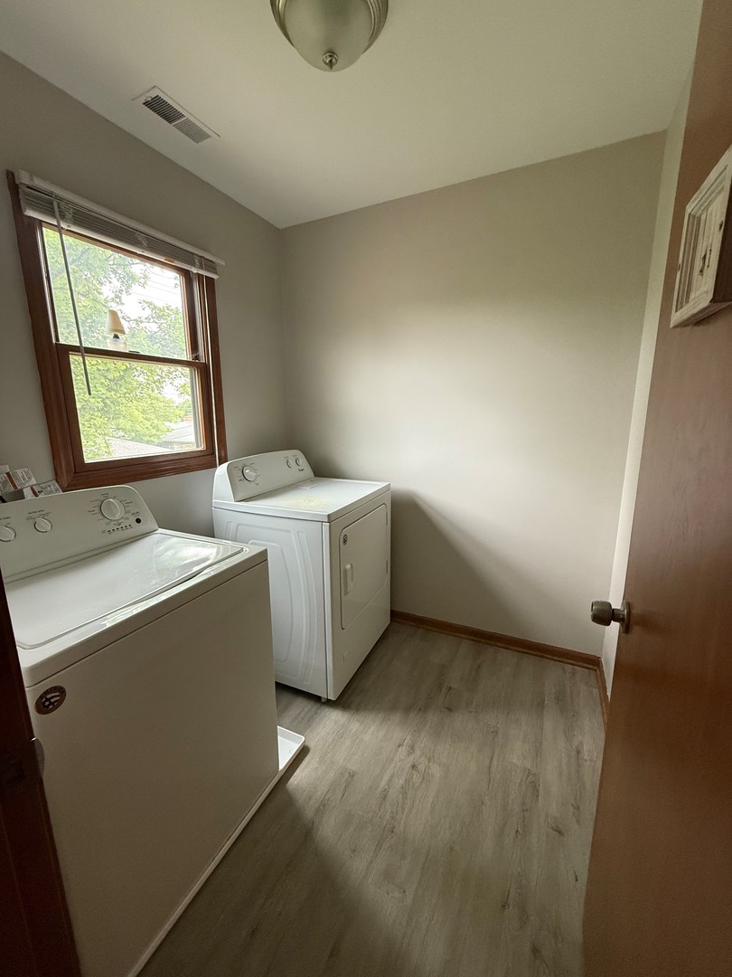 674 East Algonquin Road Des Plaines, IL 60016 - Photo 16 of 19 a room with a sink a washer and dryer