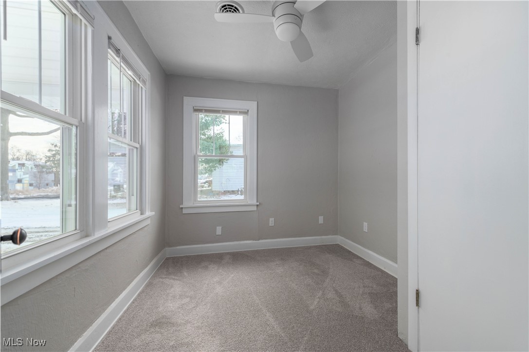 218 Roxboro Road Vermilion, OH 44089 - Photo 21 of 50 Unfurnished room featuring light carpet and ceiling fan