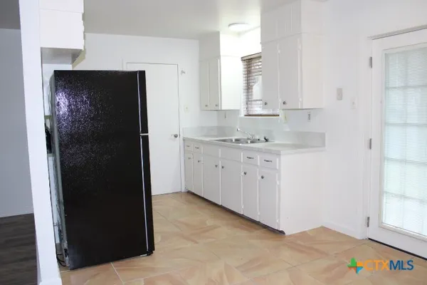 a view of a kitchen with a sink