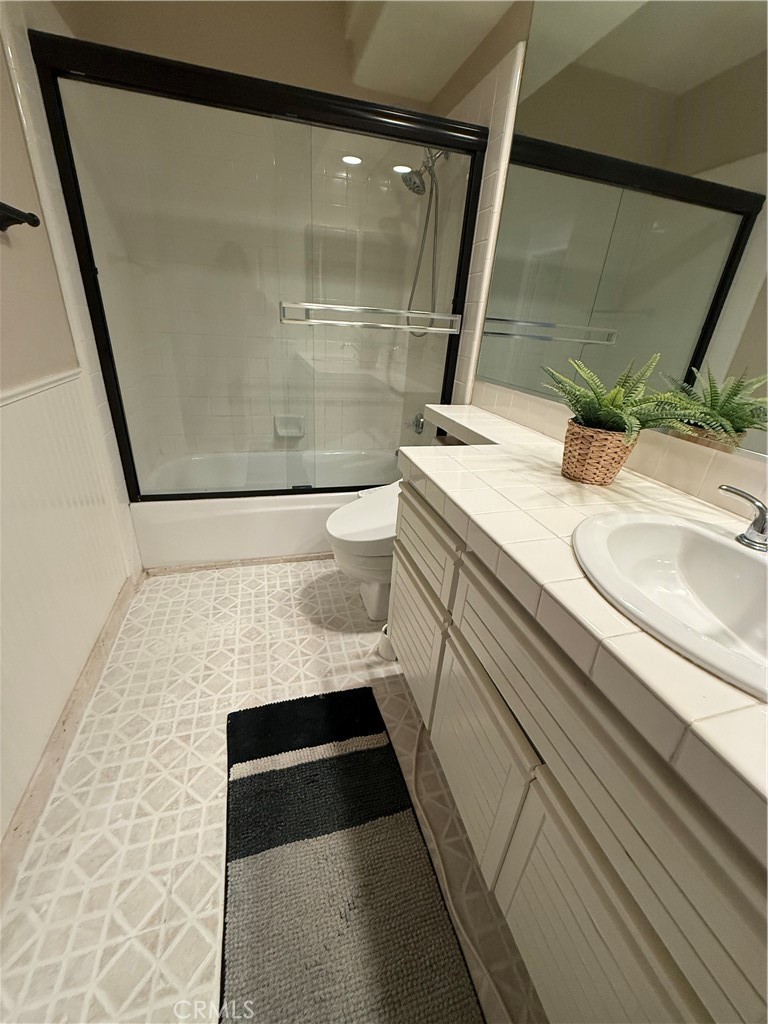 1053 Regatta Costa Mesa, CA 92627 - Photo 17 of 24 a bathroom with a sink and a mirror