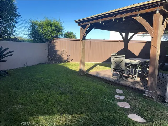 a view of yard with a table and chair