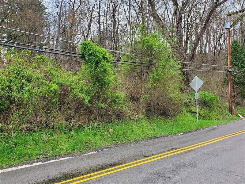 909 Harper Road Crescent, PA 15046 - Photo 2 of 2 a backyard of a house with lots of green space and plants