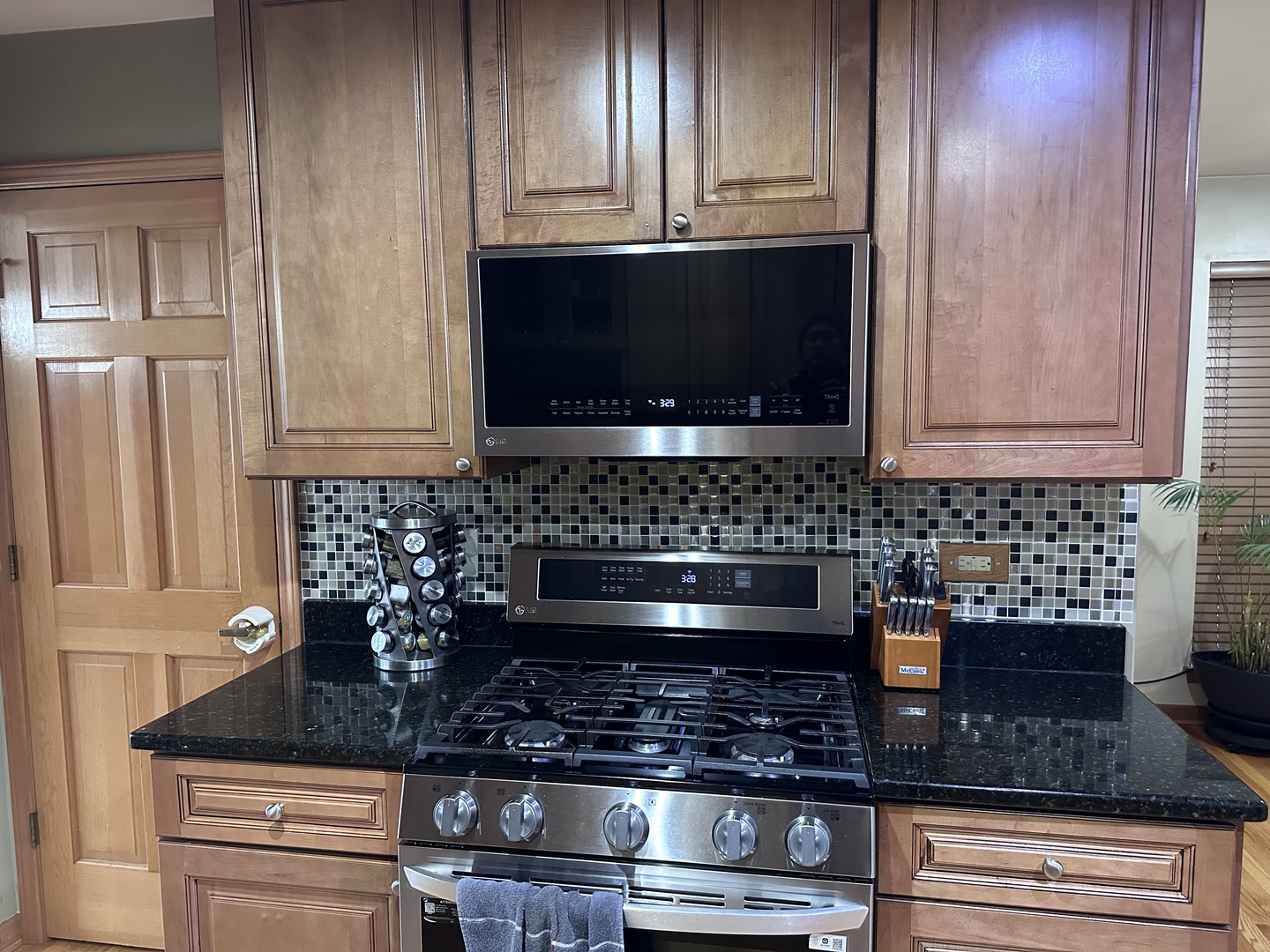 2153 Seaver Lane Hoffman Estates, IL 60169 - Photo 11 of 36 a kitchen with granite countertop a stove and cabinets