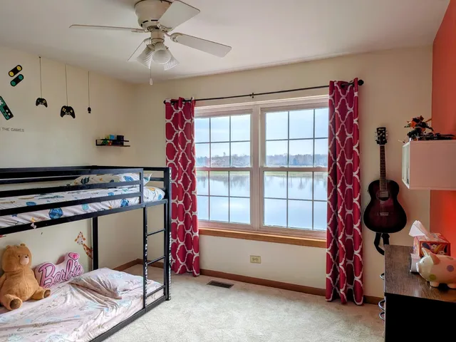 a bed room with a bed and a book shelf