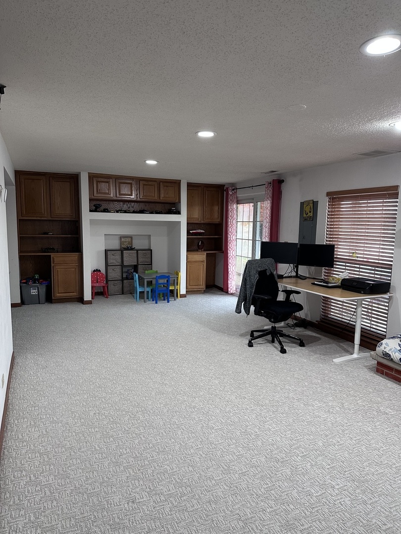 2153 Seaver Lane Hoffman Estates, IL 60169 - Photo 29 of 36 a living room with furniture and a flat screen tv