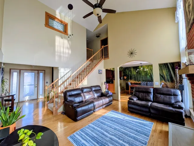 a living room with a flat screen tv and a fireplace