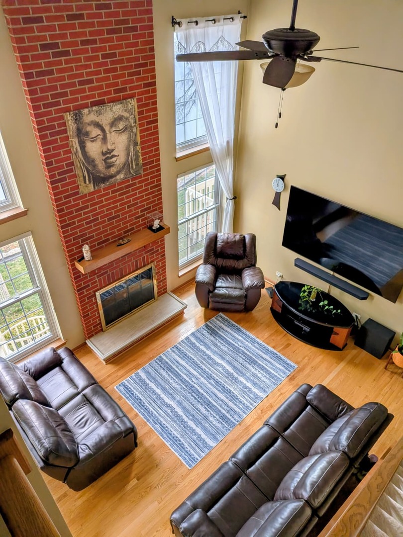 2153 Seaver Lane Hoffman Estates, IL 60169 - Photo 9 of 36 a living room with furniture and a rug