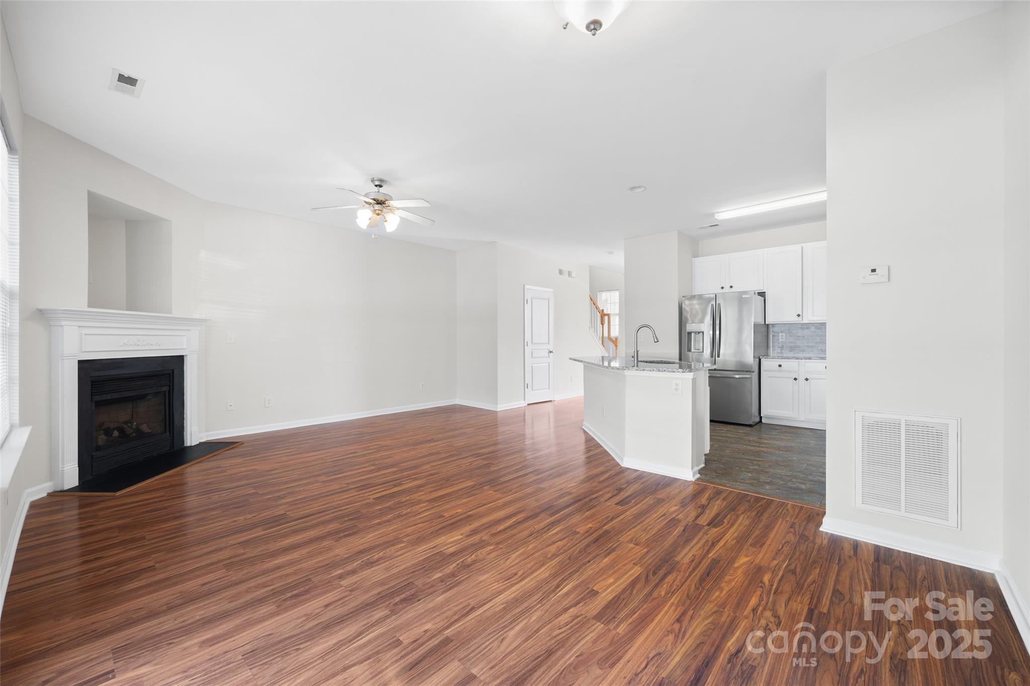975 Copperstone Lane Fort Mill, SC 29708 - Photo 11 of 35 a view of a kitchen with wooden floor and a kitchen space