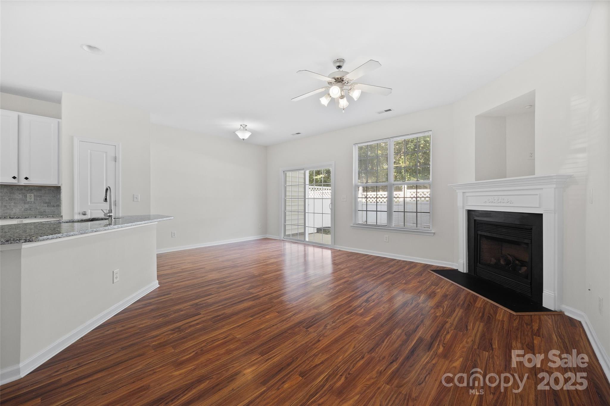 975 Copperstone Lane Fort Mill, SC 29708 - Photo 7 of 35 a view of empty room with wooden floor and fireplace