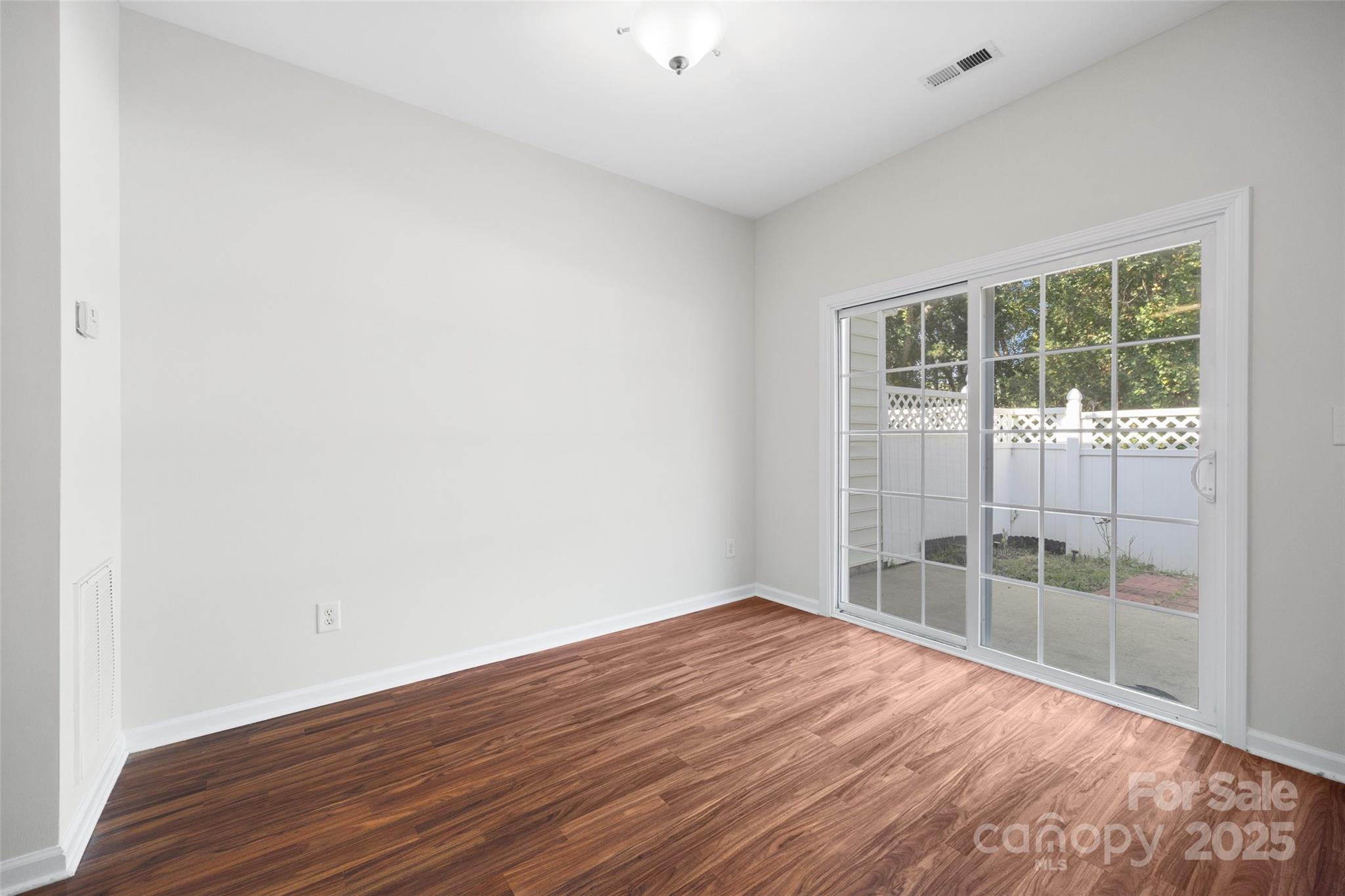 975 Copperstone Lane Fort Mill, SC 29708 - Photo 10 of 35 a view of empty room with wooden floor and fan