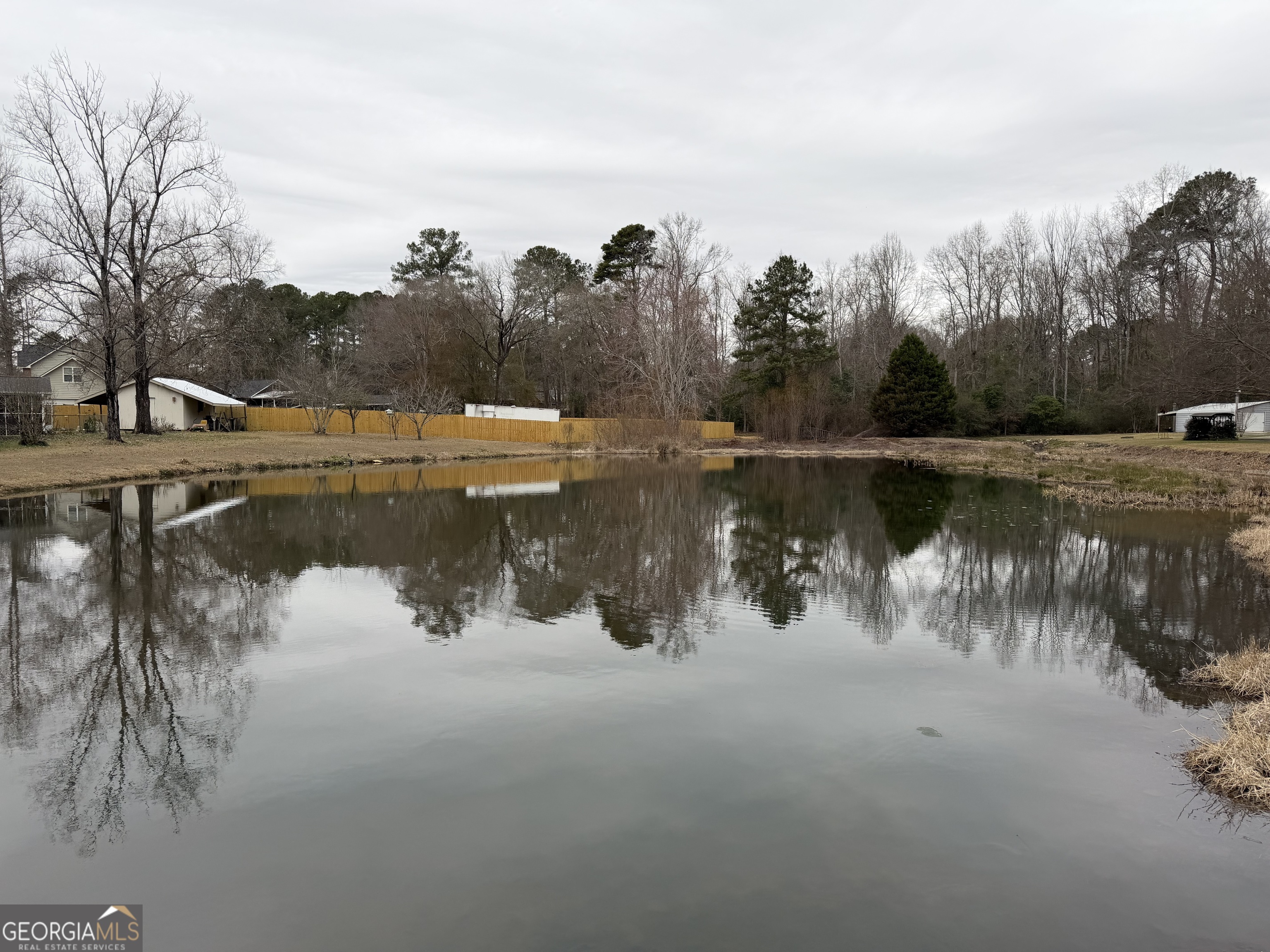 223 Trinity Road Dublin, GA 31021 - Photo 11 of 42 a view of a lake view with houses in the back