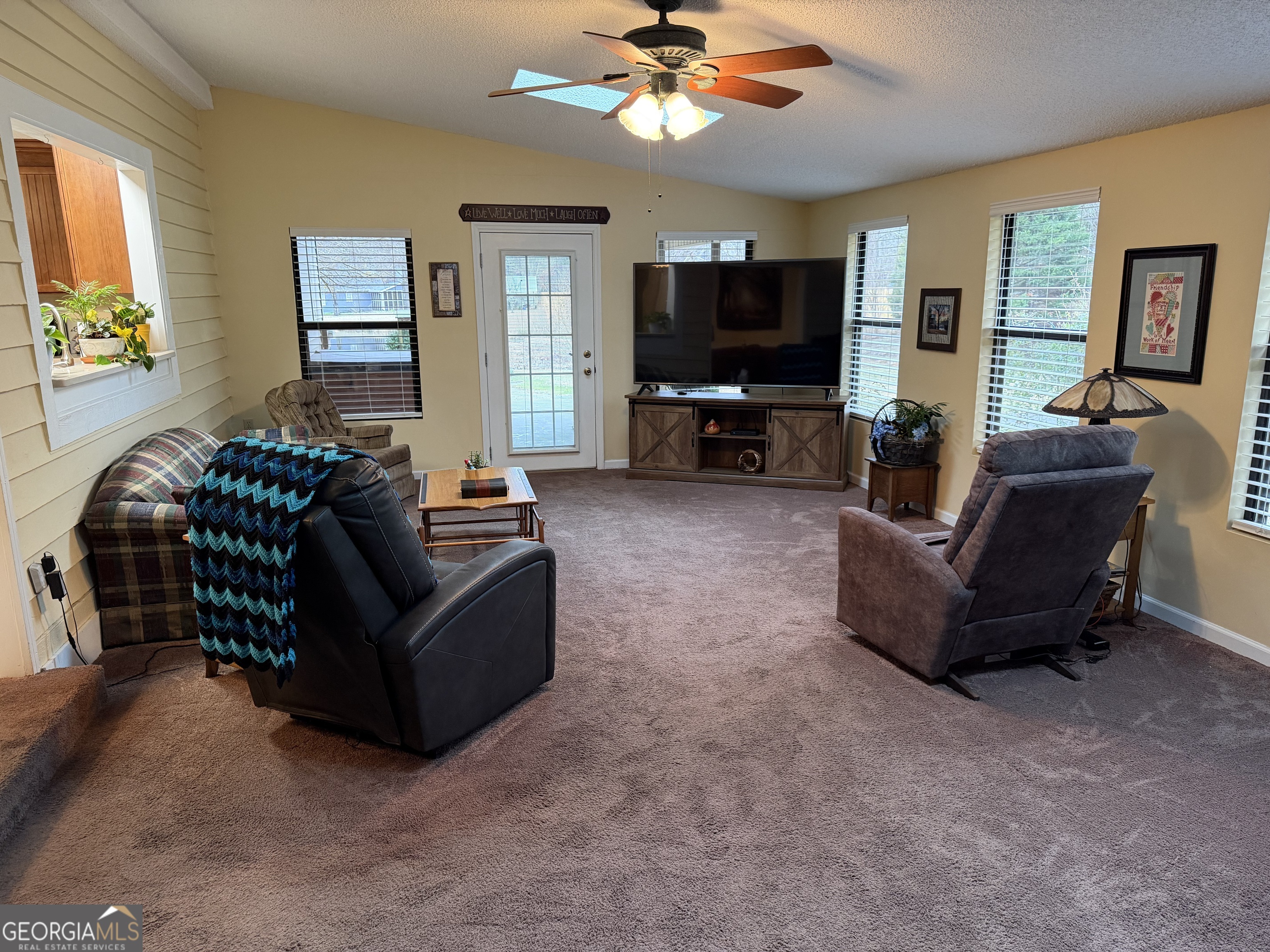 223 Trinity Road Dublin, GA 31021 - Photo 19 of 42 a living room with furniture and a flat screen tv