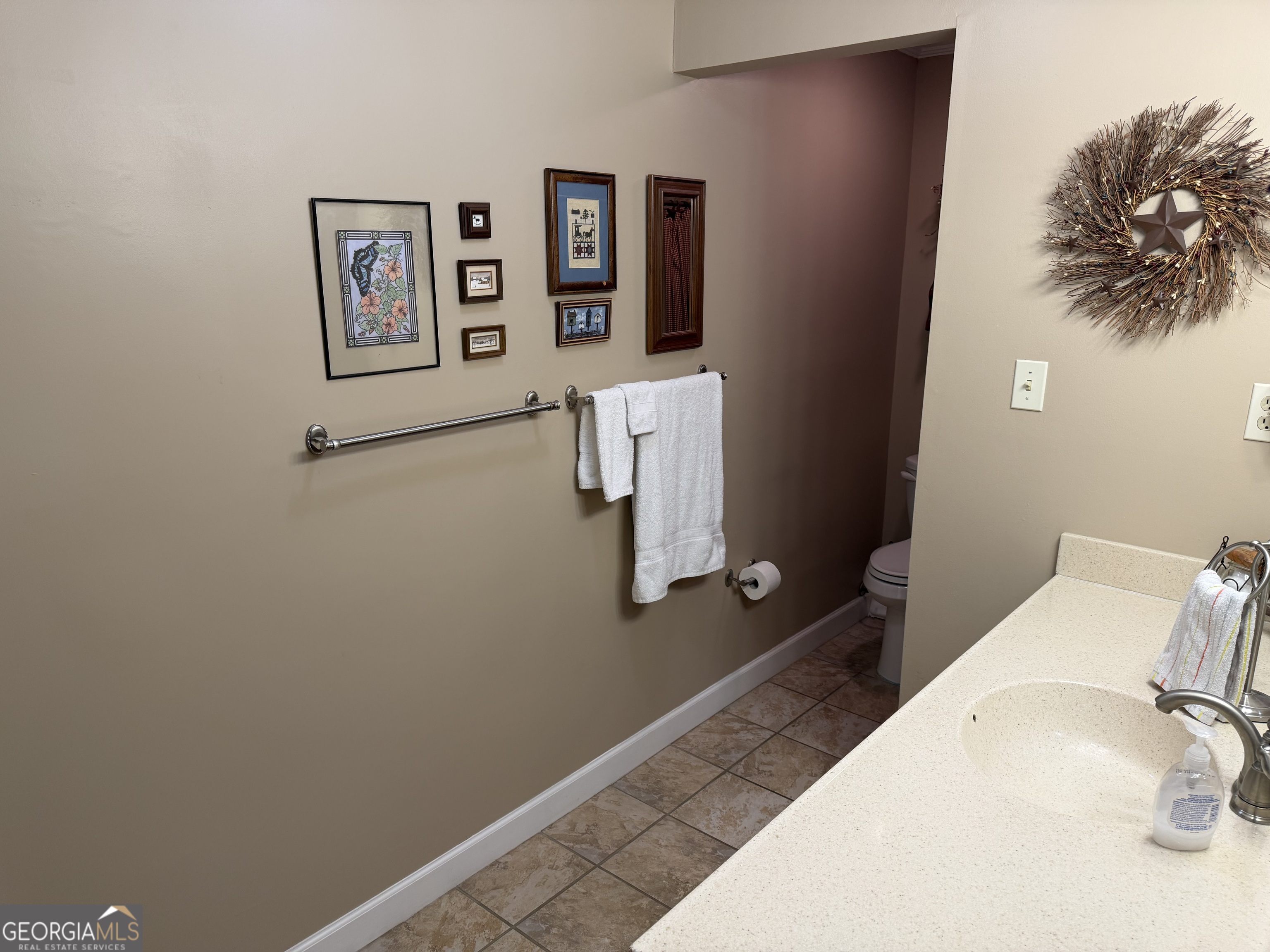 223 Trinity Road Dublin, GA 31021 - Photo 27 of 42 a bathroom with a toilet and a shower