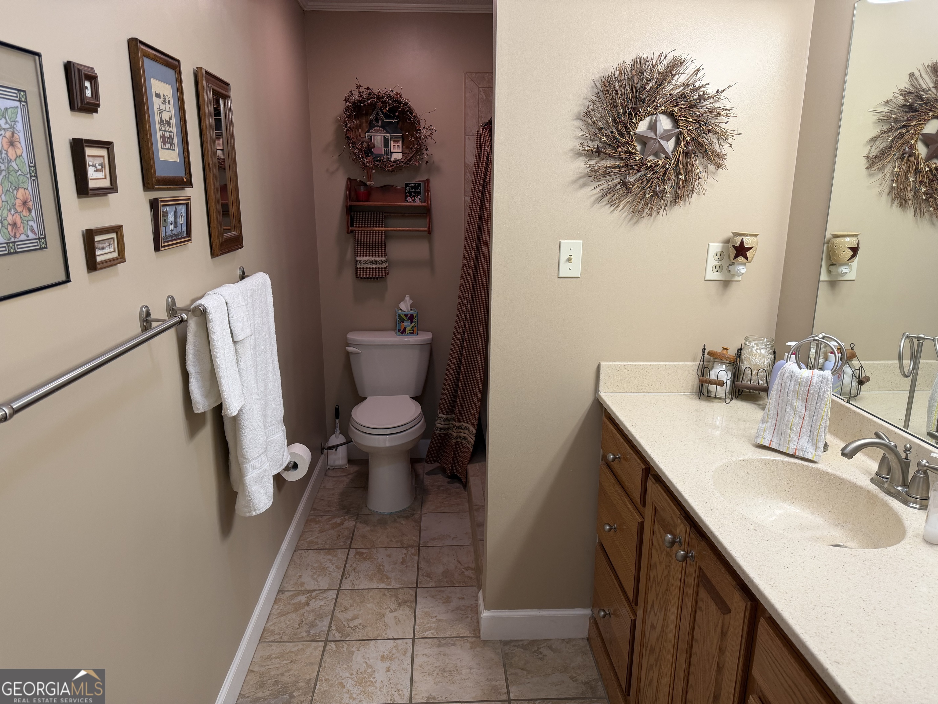 223 Trinity Road Dublin, GA 31021 - Photo 28 of 42 a bathroom with a sink toilet and a mirror