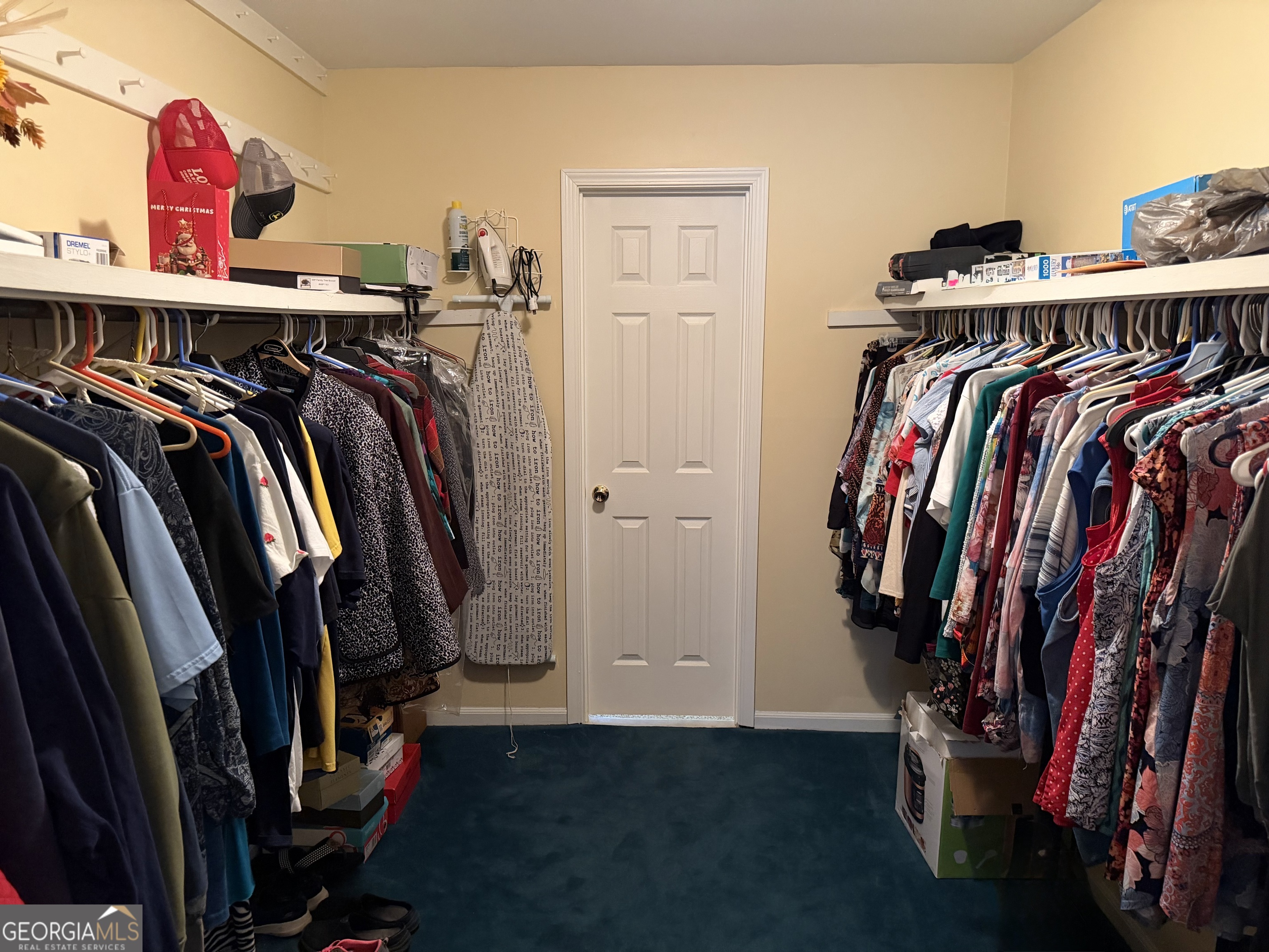 223 Trinity Road Dublin, GA 31021 - Photo 30 of 42 a view of walk in closet with clothes and shoes