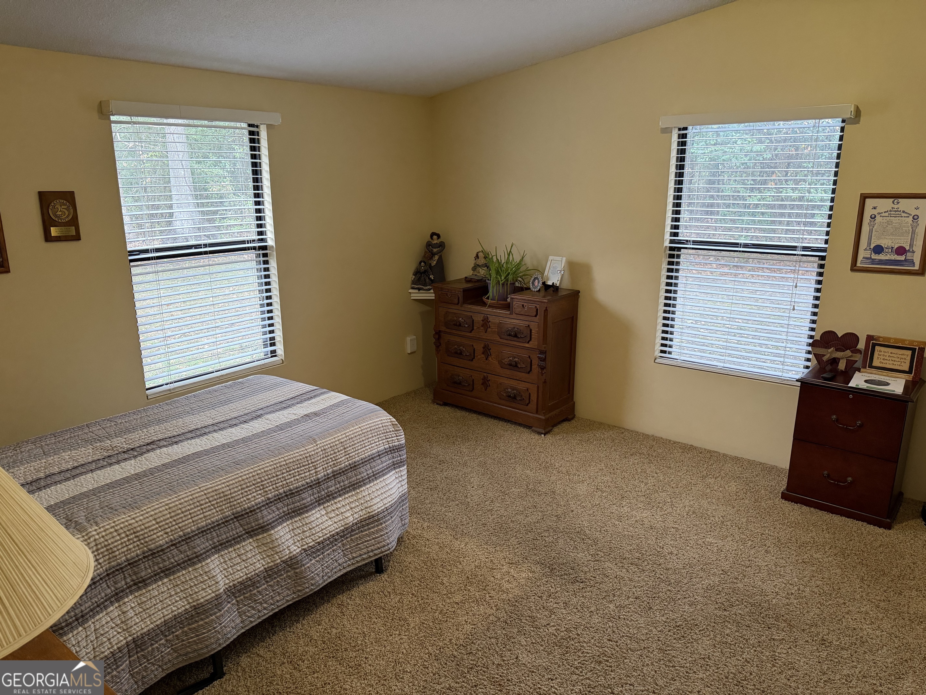223 Trinity Road Dublin, GA 31021 - Photo 31 of 42 a bedroom with a bed and a window
