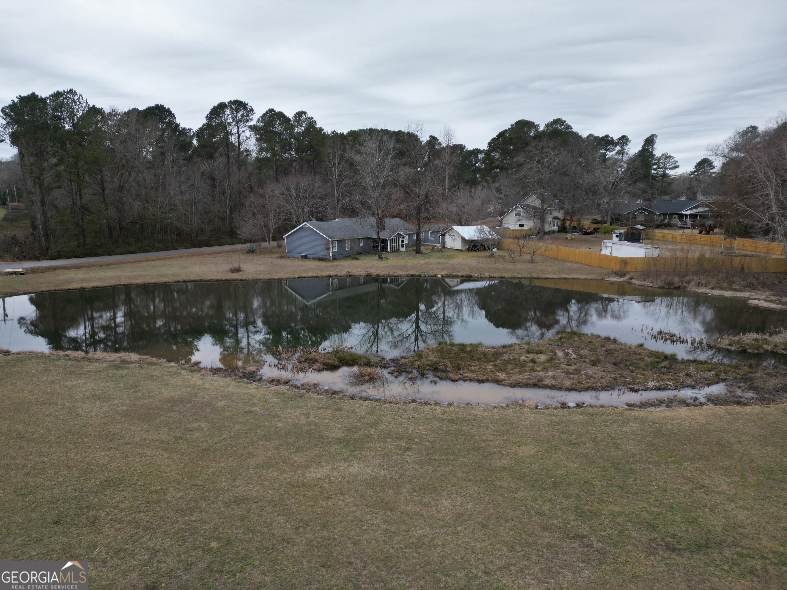 223 Trinity Road Dublin, GA 31021 - Photo 5 of 42 a view of a water fountain with a lake view