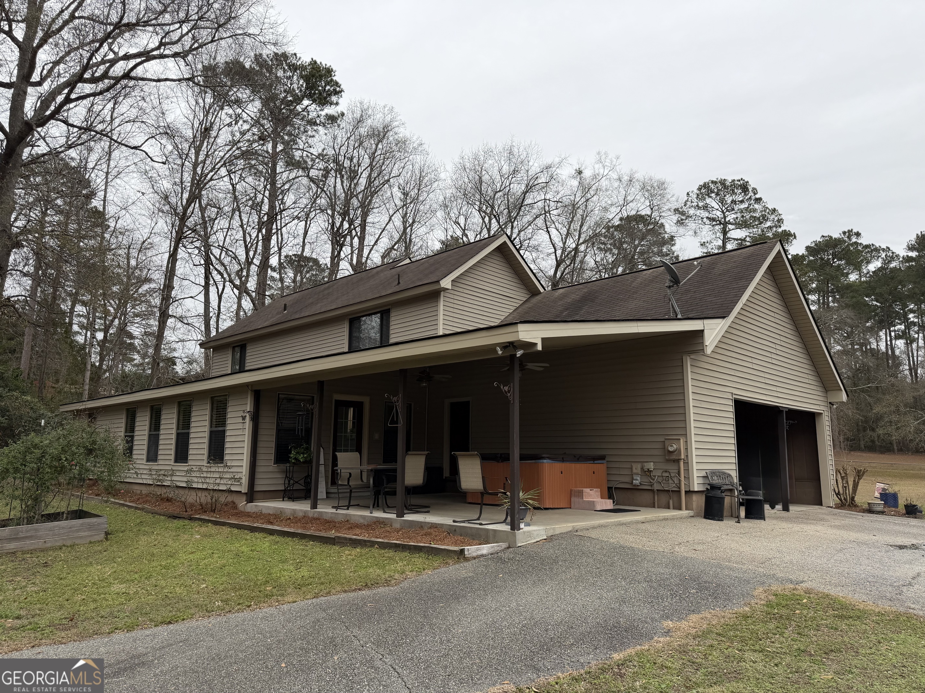 223 Trinity Road Dublin, GA 31021 - Photo 8 of 42 a view of a house with backyard porch and sitting area