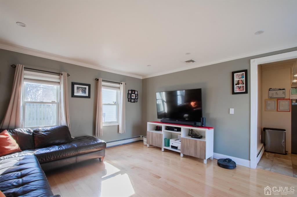 3 Stone Court Old Bridge, NJ 07747 - Photo 14 of 25 a living room with furniture and a flat screen tv