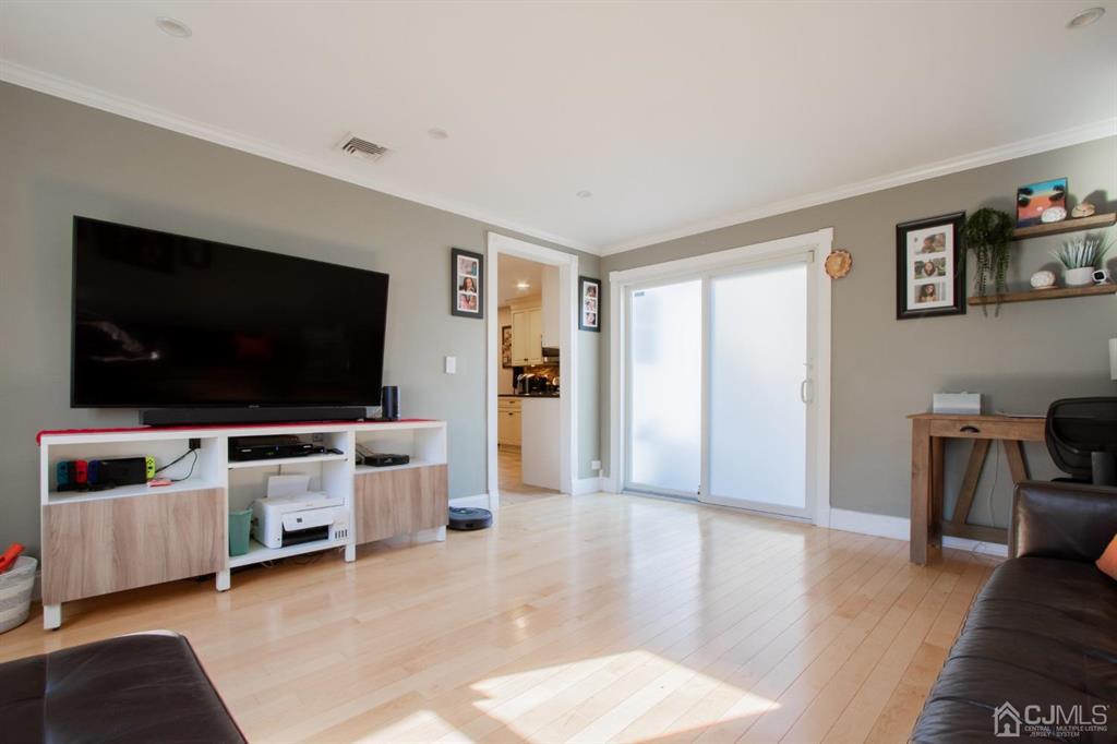 3 Stone Court Old Bridge, NJ 07747 - Photo 15 of 25 a living room with furniture and a flat screen tv