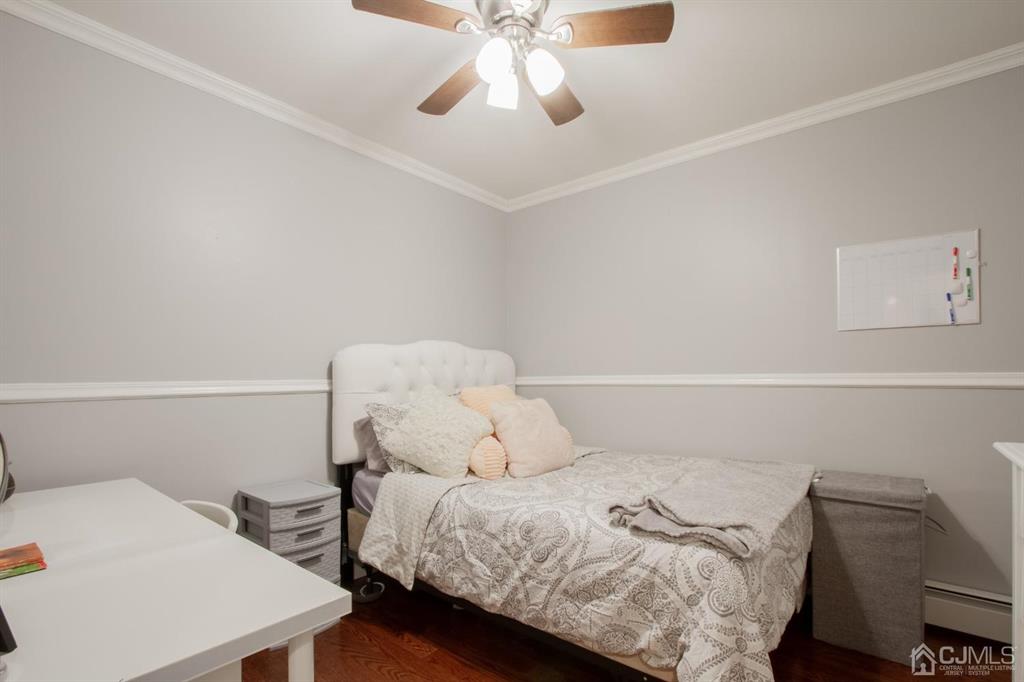 3 Stone Court Old Bridge, NJ 07747 - Photo 19 of 25 a bedroom with a bed and a chandelier
