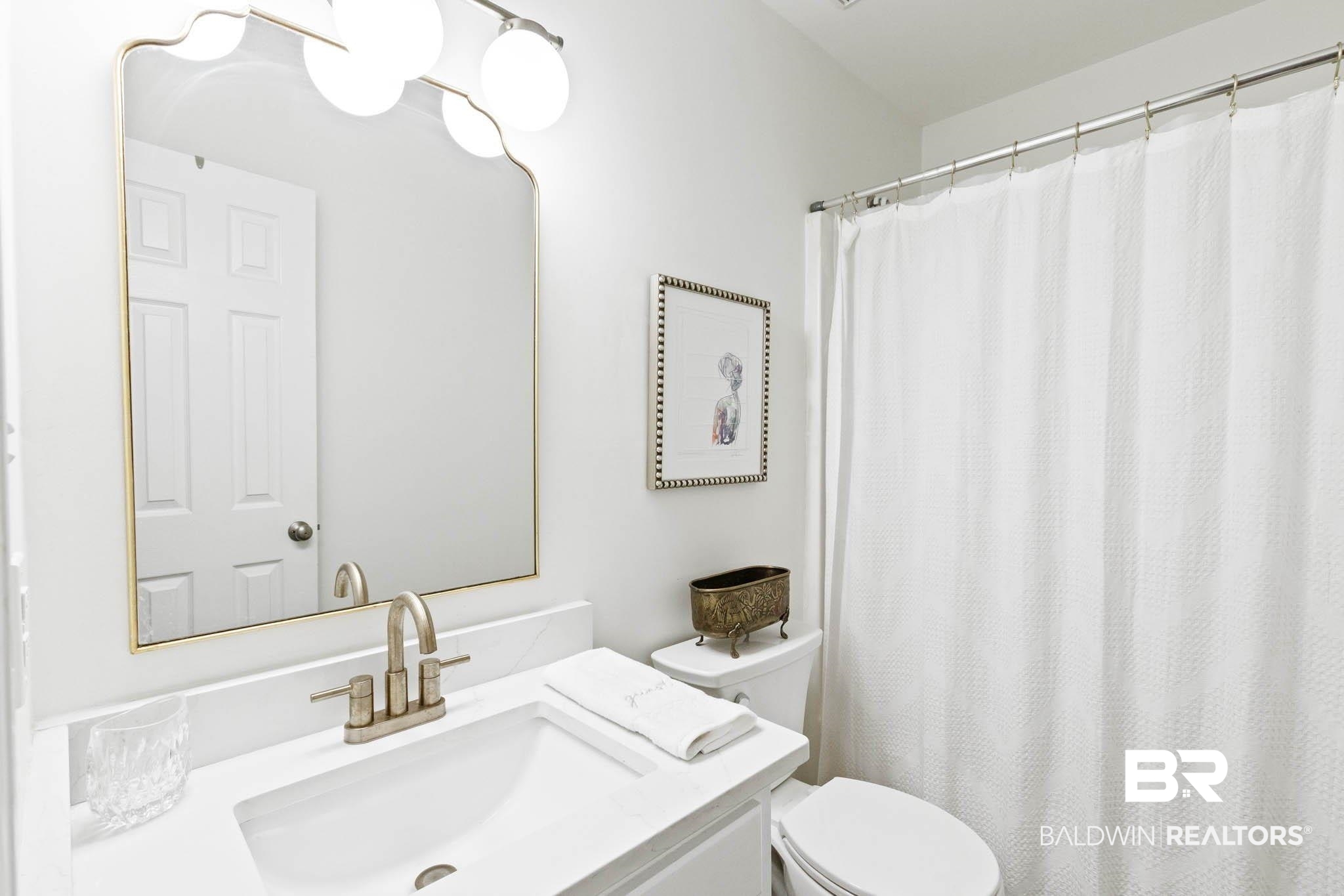 20685 Lowry Drive Fairhope, AL 36532 - Photo 38 of 48 Bathroom featuring vanity and a shower with curtain