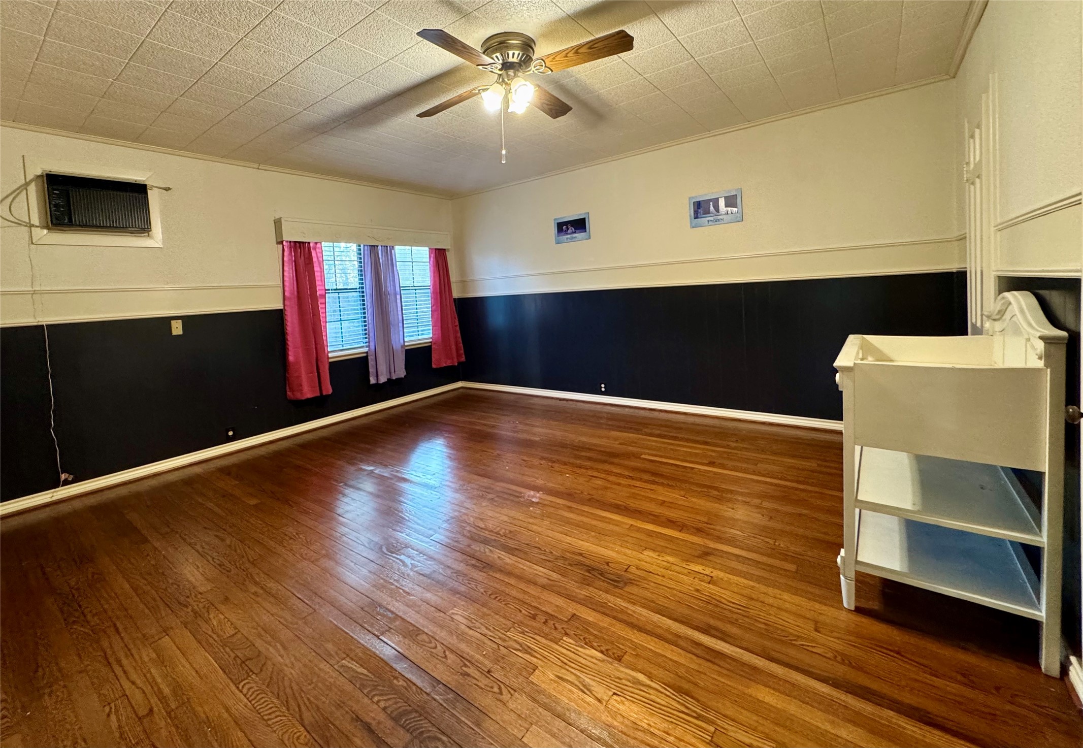 3706 College Street Damon, TX 77430 - Photo 18 of 22 a view of an empty room with wooden floor and a window