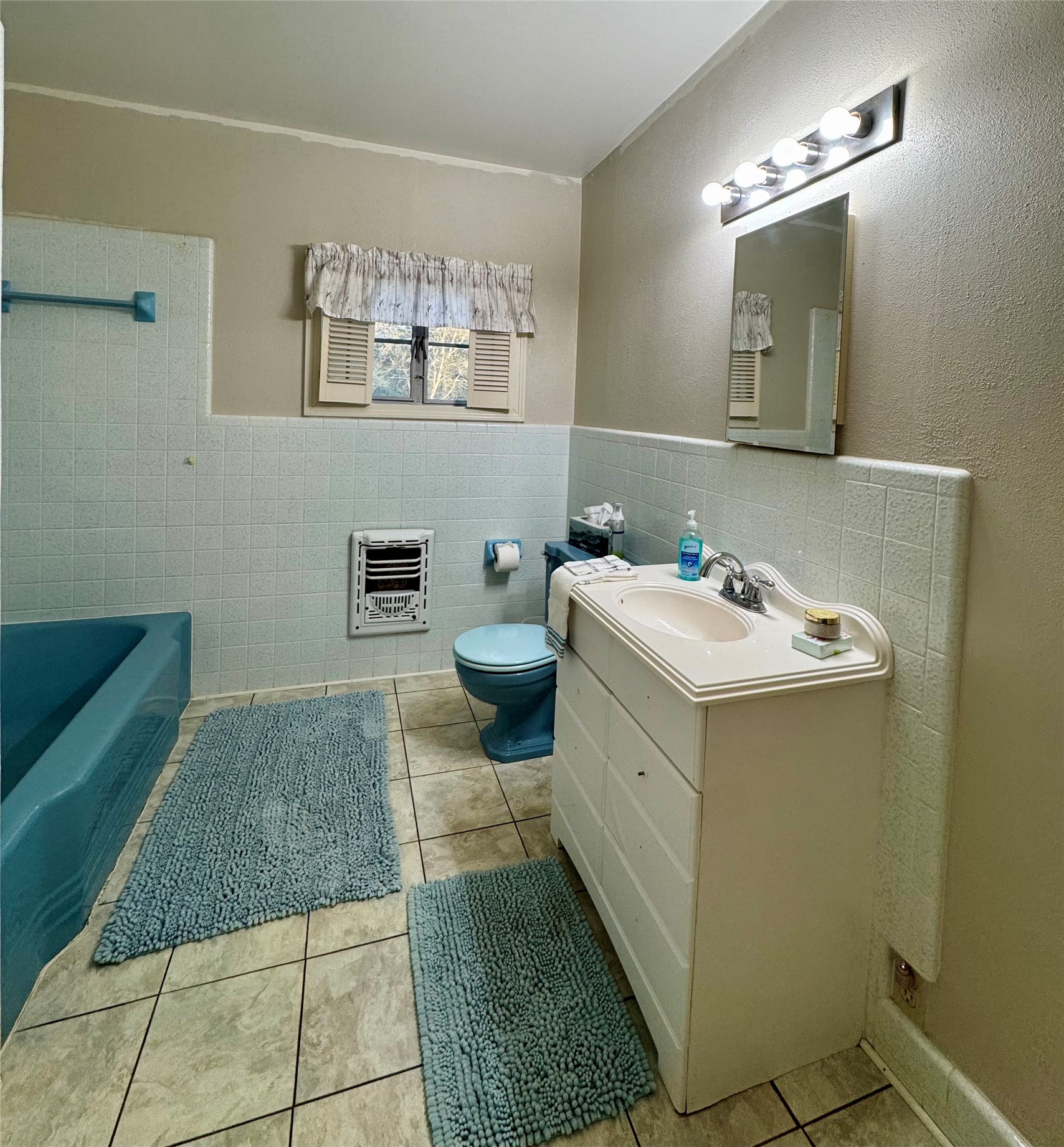 3706 College Street Damon, TX 77430 - Photo 19 of 22 a bathroom with a sink and a mirror
