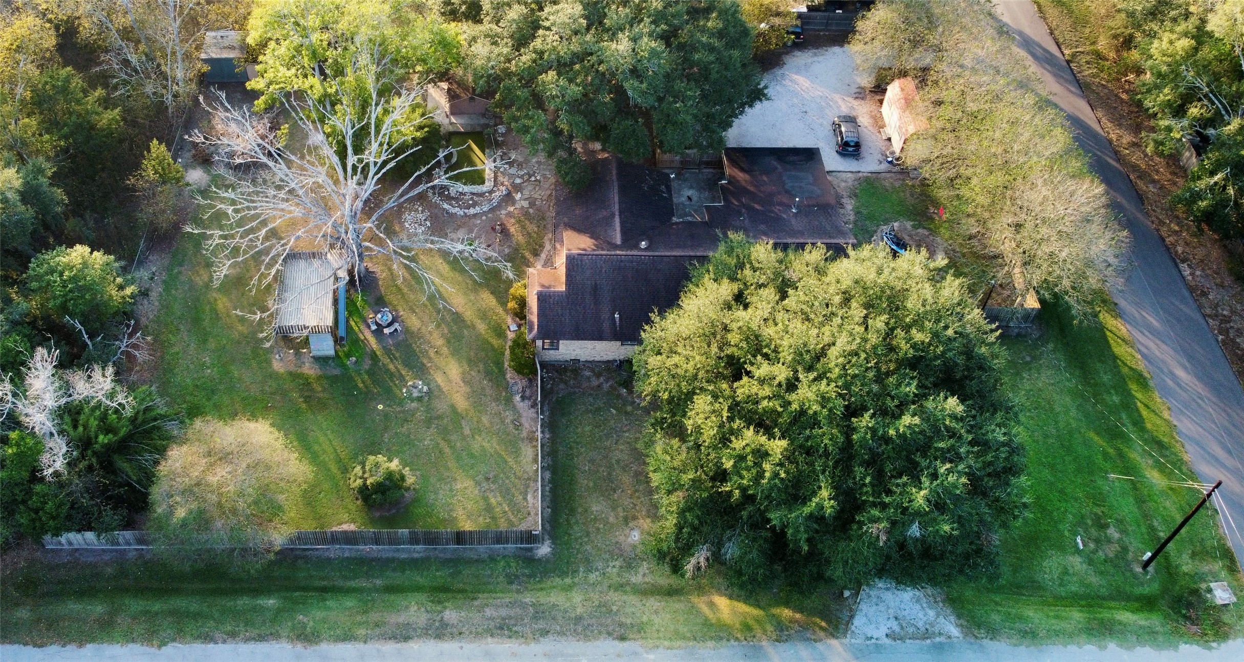 3706 College Street Damon, TX 77430 - Photo 4 of 22 a backyard of a house with lots of green space