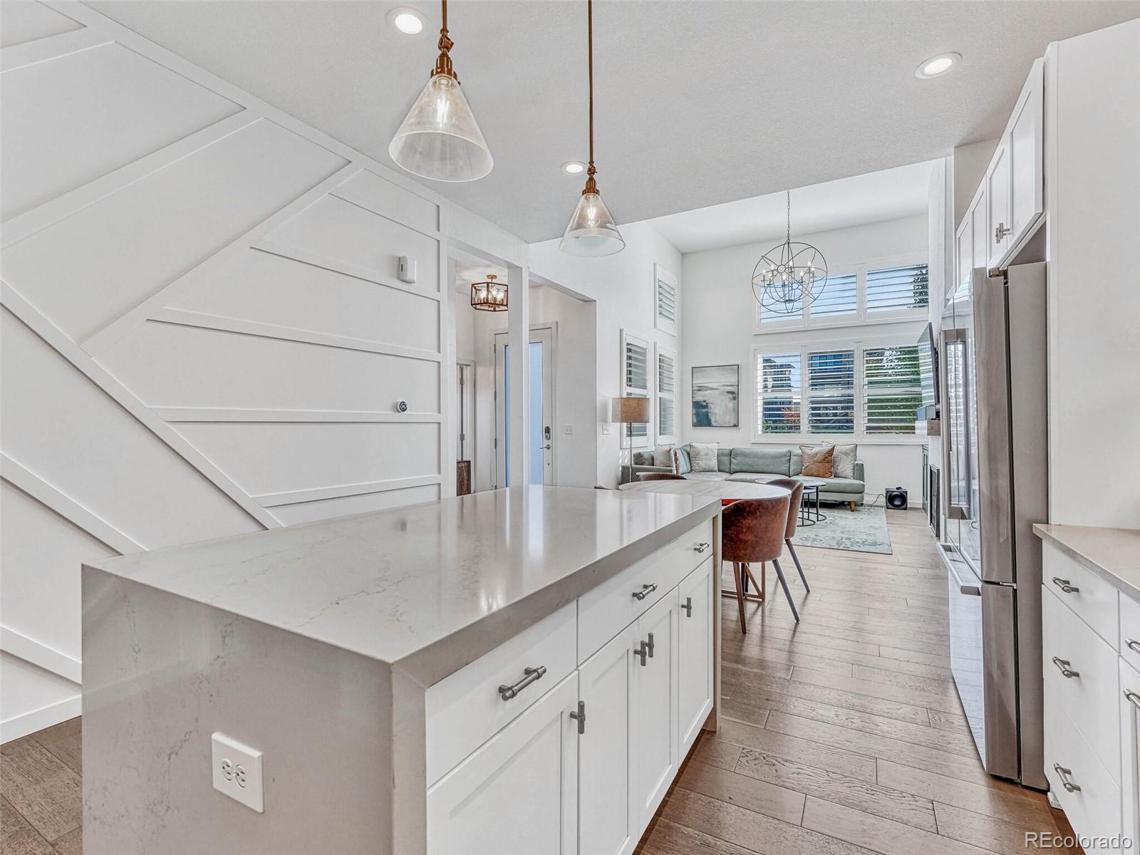 10132 Belvedere Loop Lone Tree, CO 80124 - Photo 11 of 37 a kitchen with counter top space and wooden floor