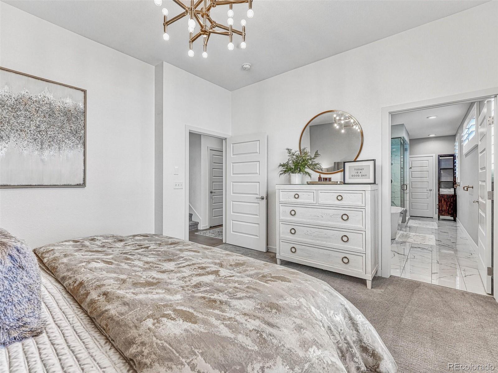 10132 Belvedere Loop Lone Tree, CO 80124 - Photo 13 of 37 a bedroom with a bed and a dresser