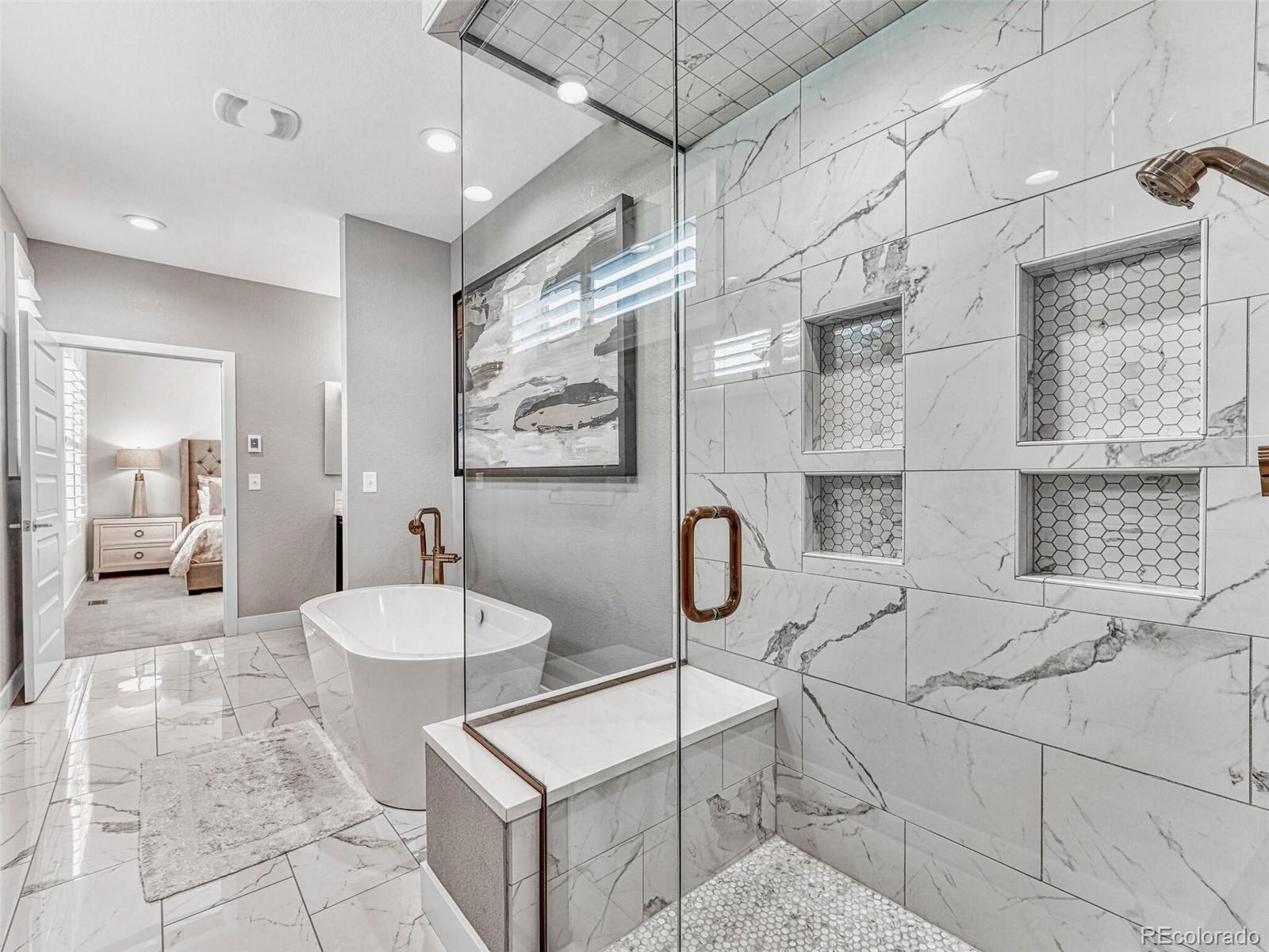 10132 Belvedere Loop Lone Tree, CO 80124 - Photo 16 of 37 a spacious bathroom with a sink a toilet and shower