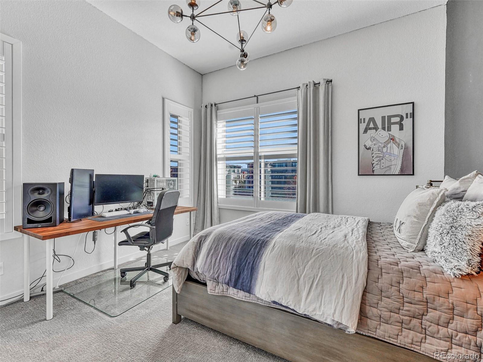 10132 Belvedere Loop Lone Tree, CO 80124 - Photo 20 of 37 a bedroom with a bed and a desk
