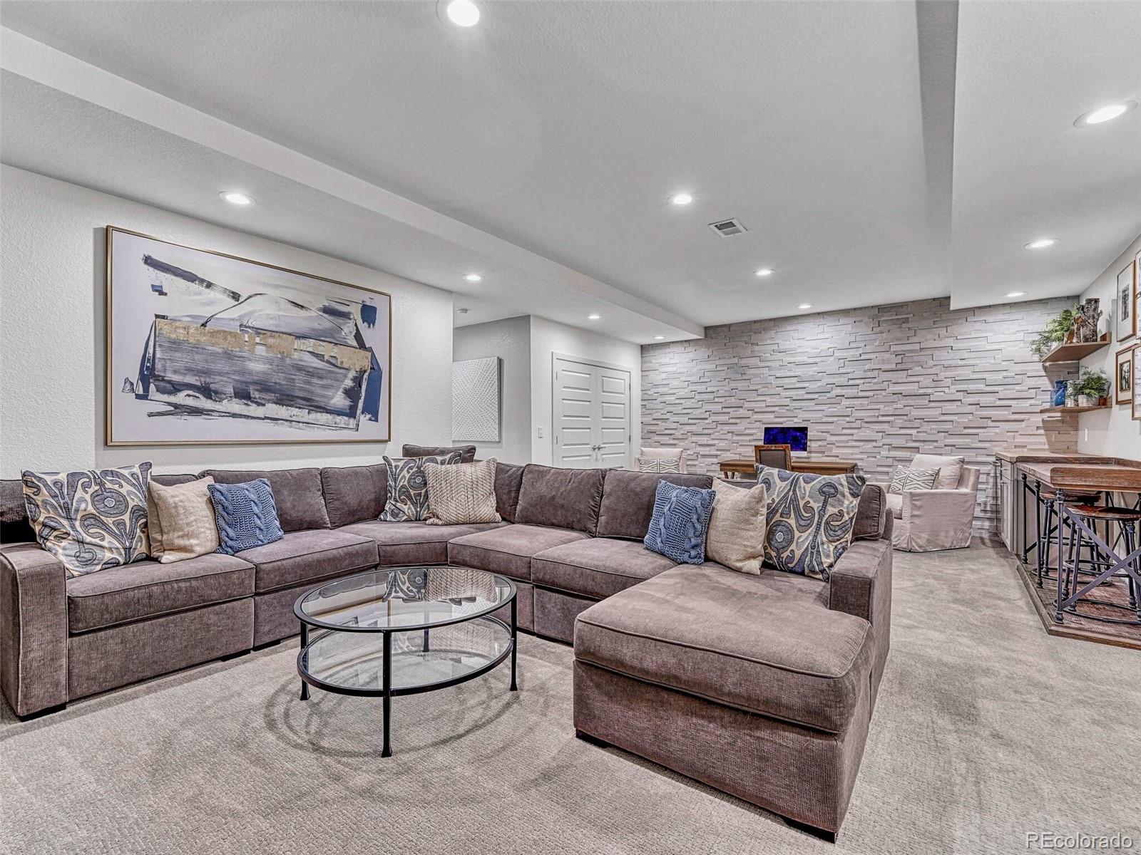 10132 Belvedere Loop Lone Tree, CO 80124 - Photo 24 of 37 a living room with furniture and kitchen view