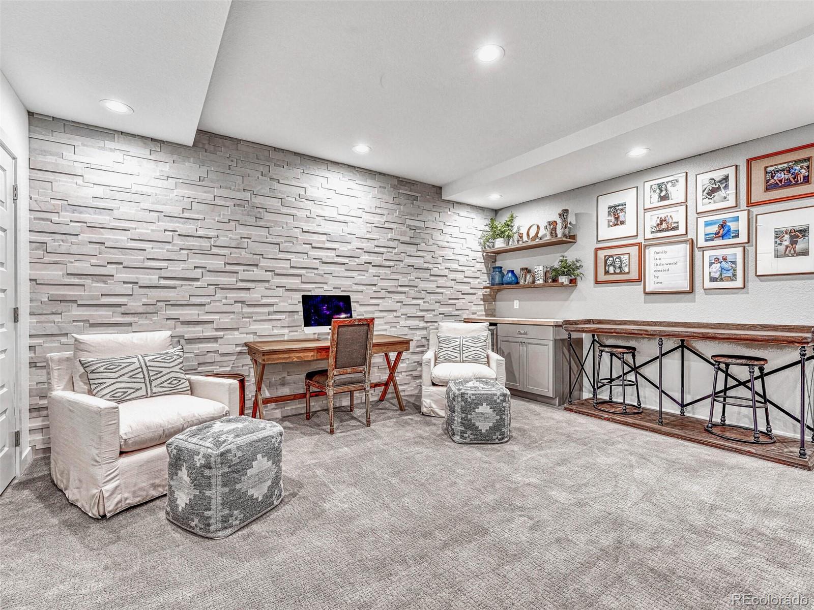 10132 Belvedere Loop Lone Tree, CO 80124 - Photo 26 of 37 a living room with furniture and a flat screen tv