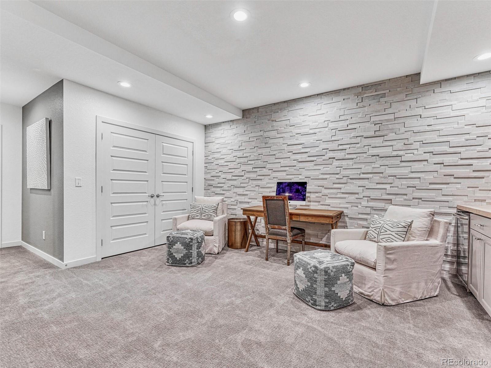 10132 Belvedere Loop Lone Tree, CO 80124 - Photo 27 of 37 a living room with furniture and a flat screen tv