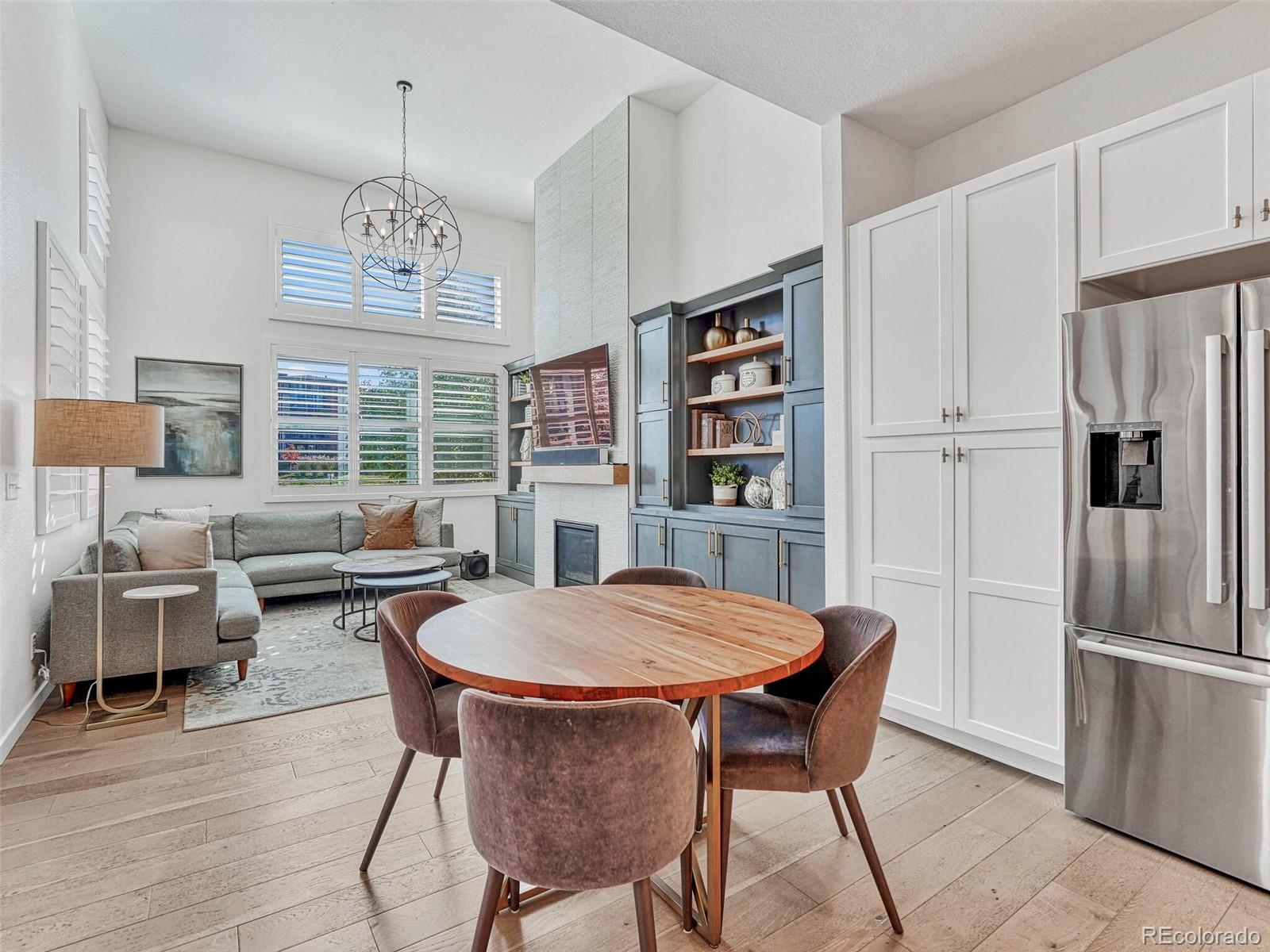 10132 Belvedere Loop Lone Tree, CO 80124 - Photo 7 of 37 a view of a dining room with furniture window and wooden floor