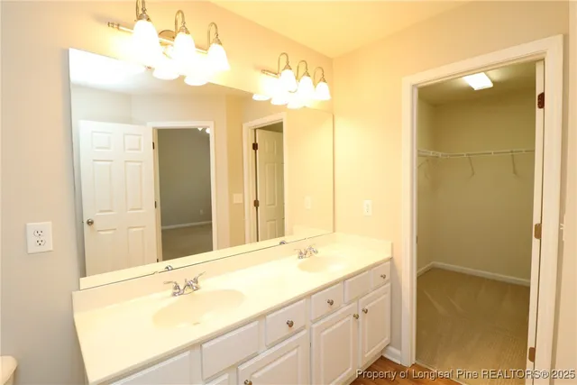a bathroom with a tub sink and shower