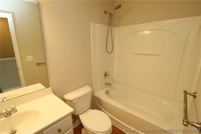 a balcony with wooden floor and trees in the background