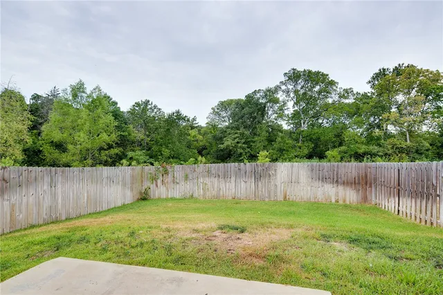 a backyard of a house with lots of green space