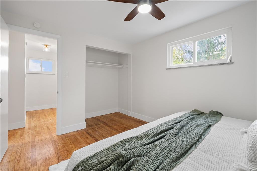 6 Tunstall Street Pittsburgh, PA 15207 - Photo 20 of 49 a bedroom with a bed and a chandelier