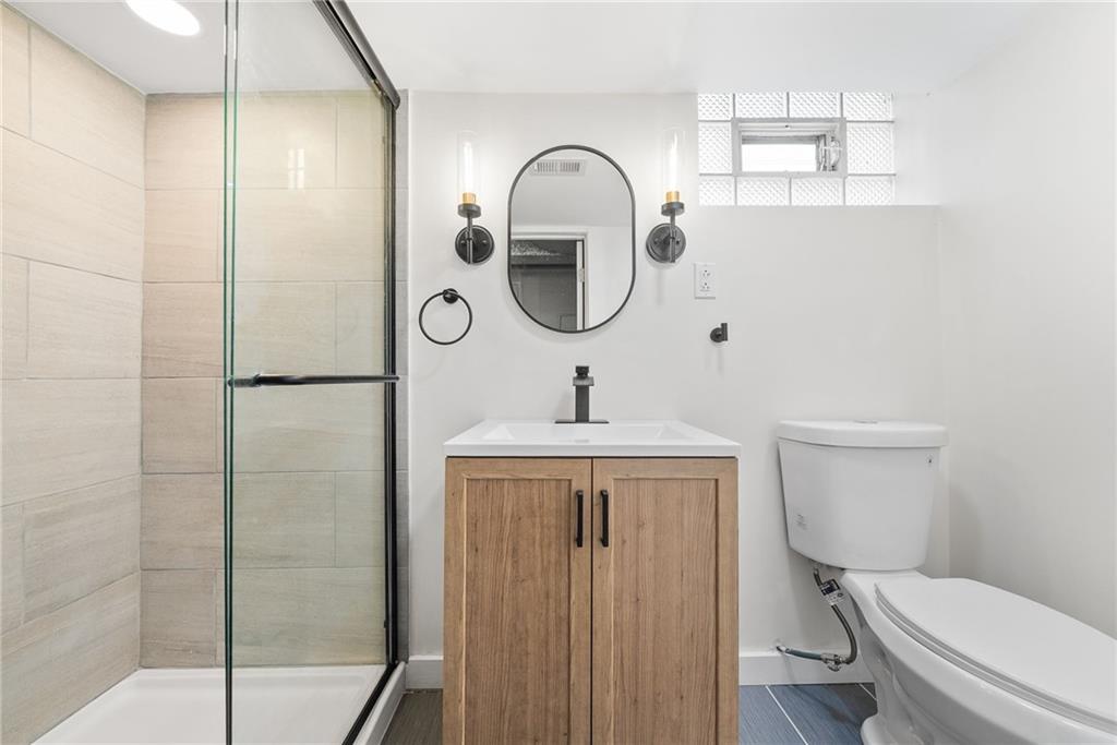 6 Tunstall Street Pittsburgh, PA 15207 - Photo 29 of 49 a bathroom with a toilet sink and shower