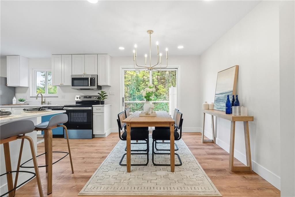 6 Tunstall Street Pittsburgh, PA 15207 - Photo 10 of 49 a kitchen with a dining table chairs and a refrigerator