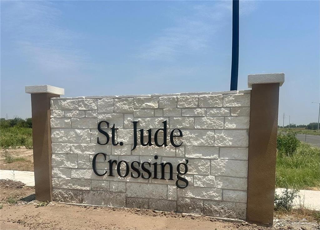 9502 North 71st Lane Mission, TX 78573 - Photo 1 of 4 Community entrance sign featuring stacked stone with contrasting smooth stucco pillars and capstones