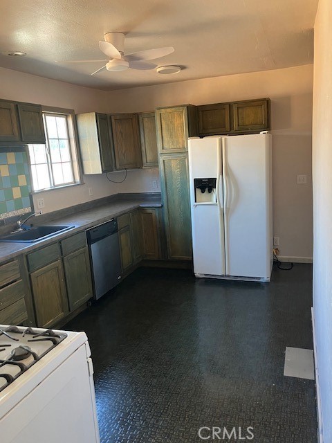 2294 Mulberry Street Chico, CA 95928 - Photo 12 of 16 a kitchen with a refrigerator and a sink